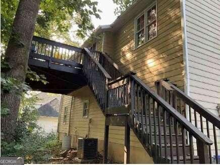 2734 Laurel View Dr, Snellville, GA 30039 - exterior space featuring stairway, a deck, and central AC unit