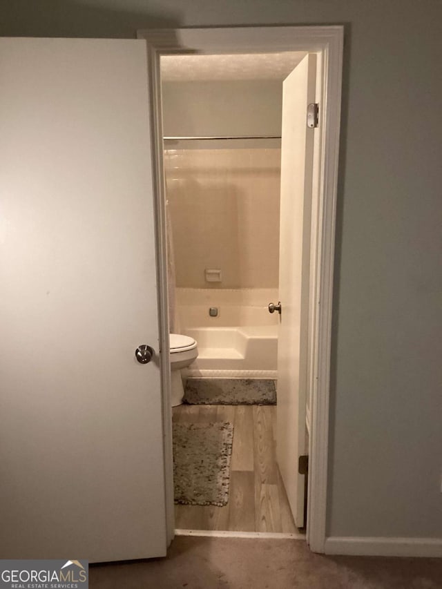 2734 Laurel View Dr, Snellville, GA 30039 - bathroom featuring toilet and tub / shower combination