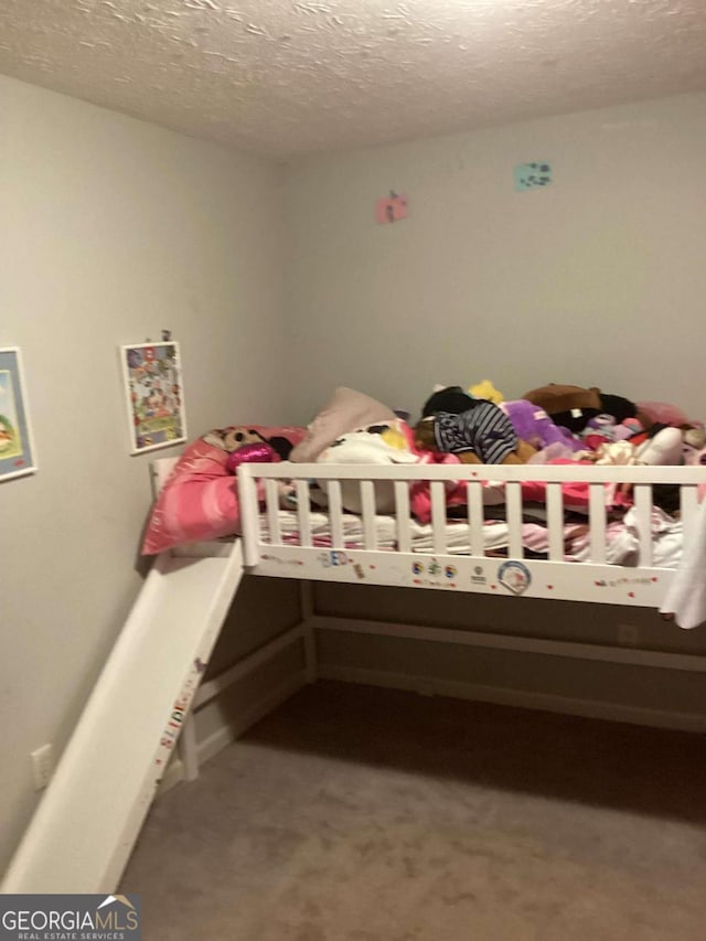 2734 Laurel View Dr, Snellville, GA 30039 - carpeted bedroom featuring a textured ceiling