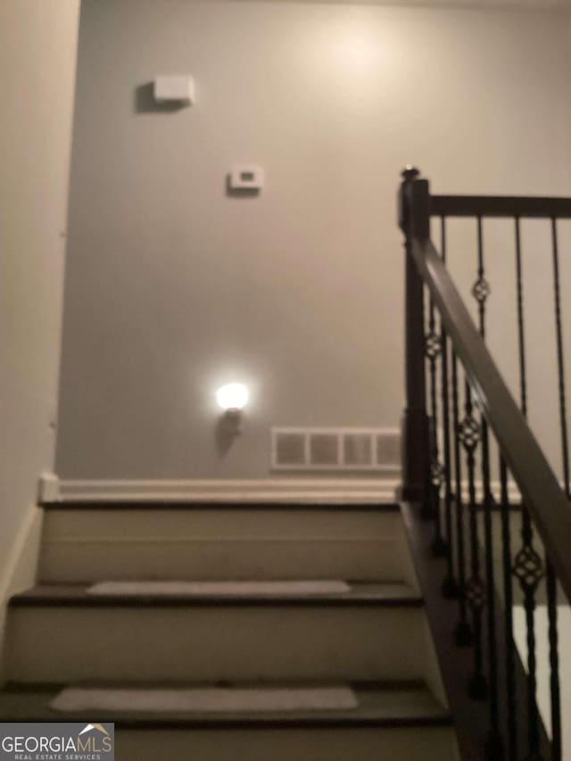 2734 Laurel View Dr, Snellville, GA 30039 - staircase featuring visible vents