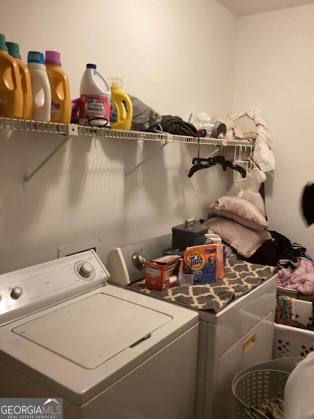 laundry area with separate washer and dryer