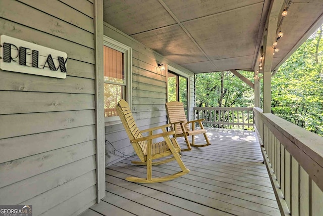 wooden terrace with covered porch