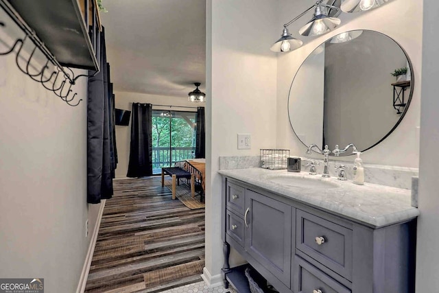 bathroom with hardwood / wood-style floors and vanity