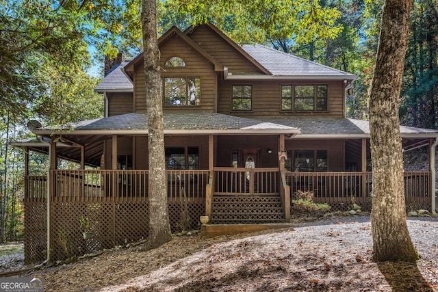 view of front of property featuring a wooden deck