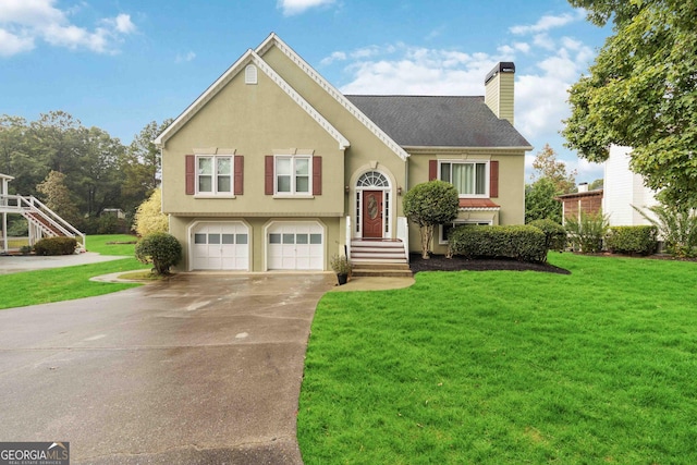 split foyer home featuring a front yard and a garage