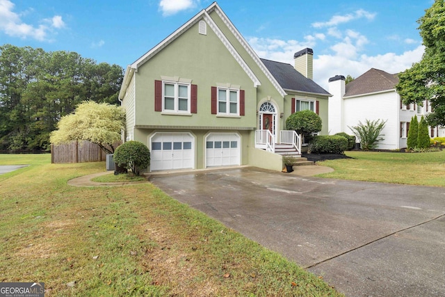 bi-level home with central AC, a garage, and a front lawn