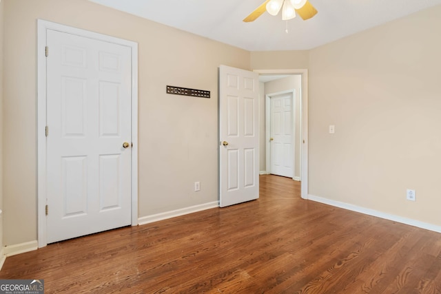 unfurnished bedroom featuring ceiling fan and wood-type flooring