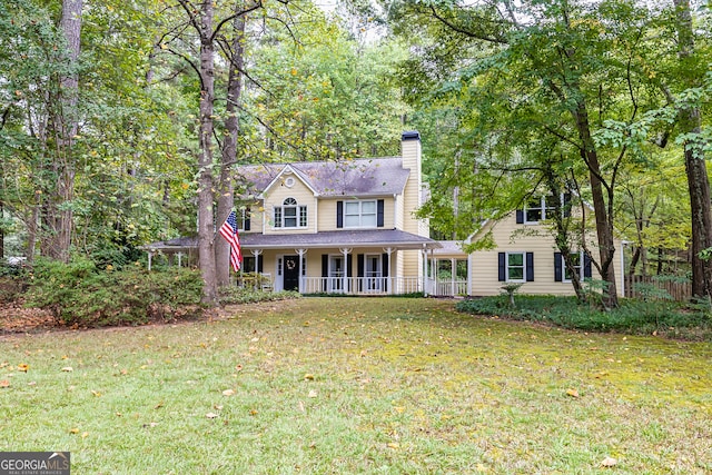 view of front facade with a porch and a front lawn