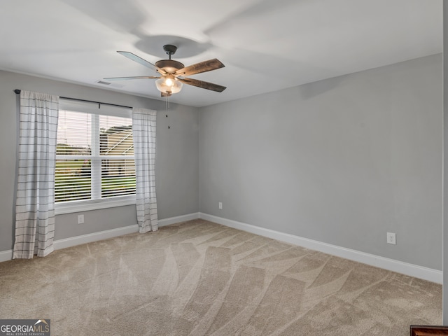 carpeted empty room with ceiling fan