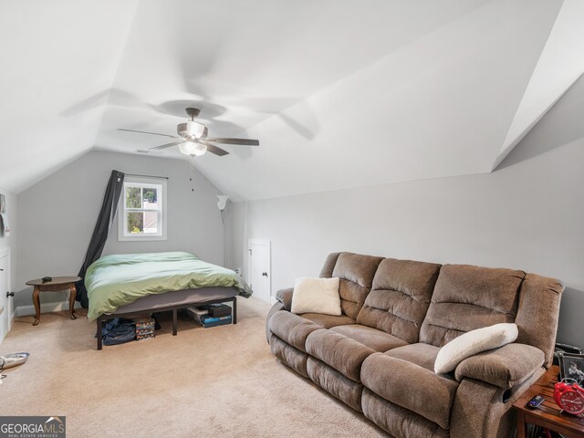 bedroom with lofted ceiling, carpet flooring, and ceiling fan