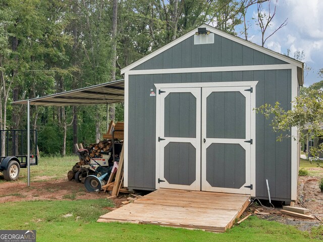 view of outbuilding with a lawn