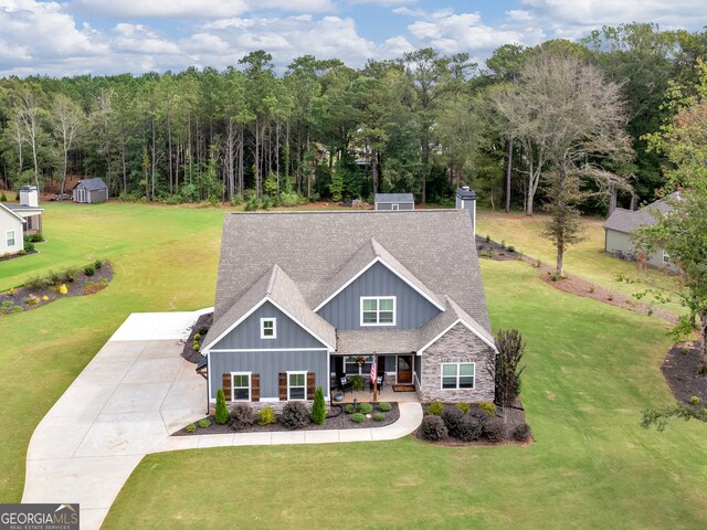 view of front of property featuring a porch and a front lawn