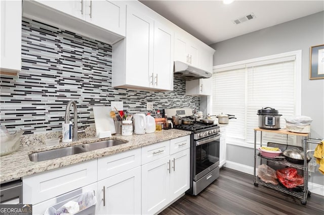 kitchen with gas stove, sink, dark hardwood / wood-style floors, and white cabinets