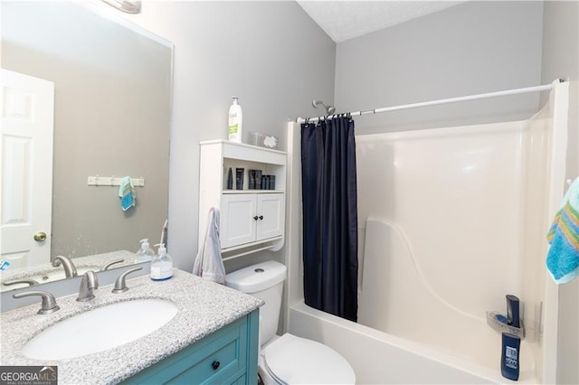 full bathroom featuring a textured ceiling, vanity, toilet, and shower / bath combination with curtain