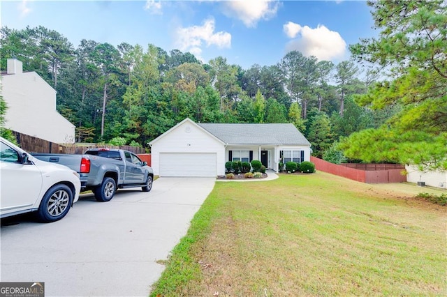 view of front of house with a garage and a front lawn