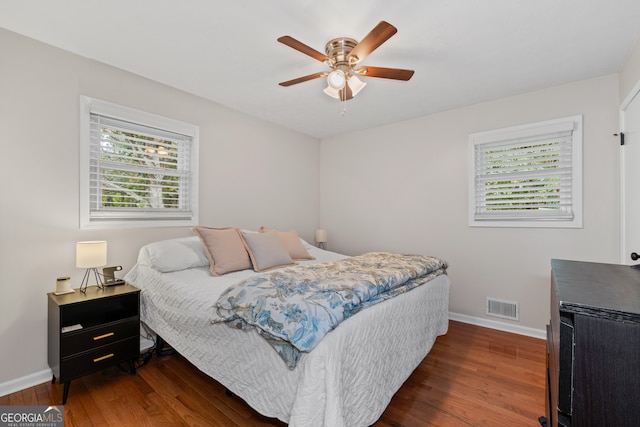 bedroom featuring ceiling fan and dark hardwood / wood-style floors