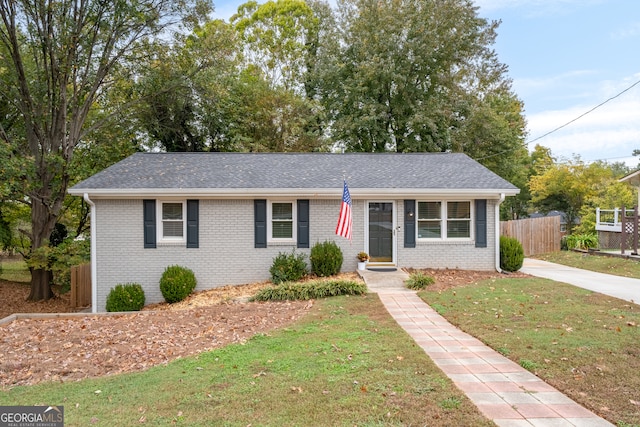 ranch-style home with a front yard