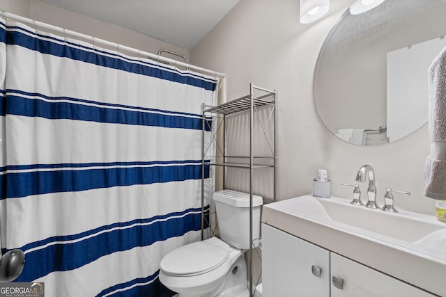 bathroom with vanity, toilet, and a shower with curtain