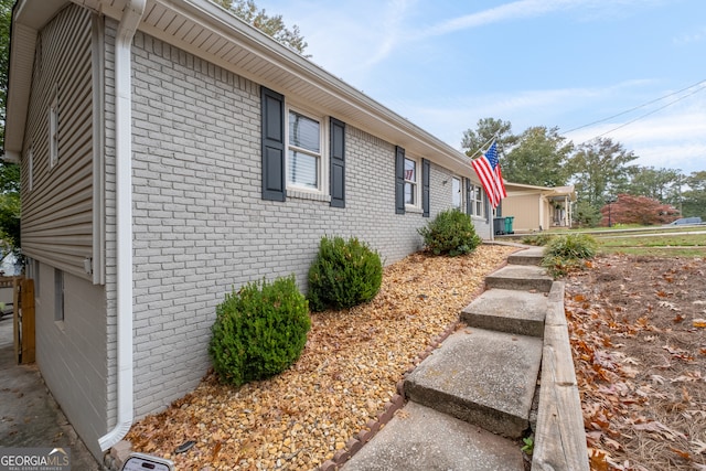 view of side of home featuring a garage