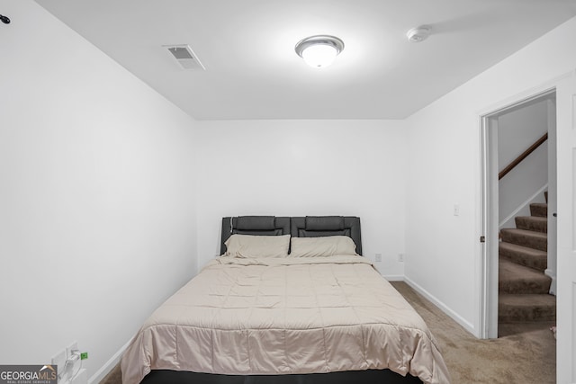 bedroom featuring carpet