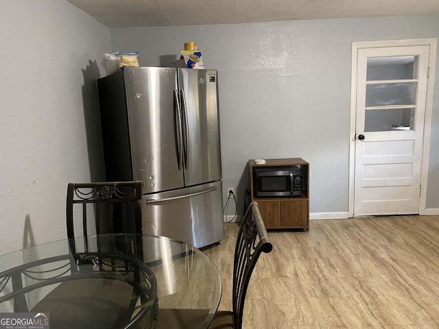 kitchen featuring appliances with stainless steel finishes and light wood-type flooring