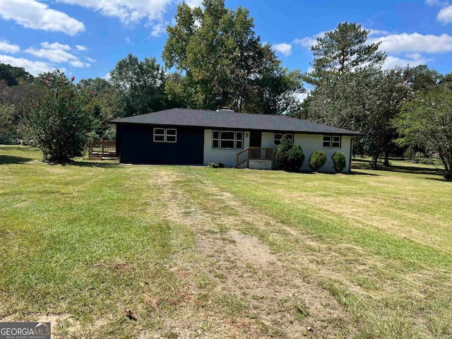 ranch-style home featuring a front yard