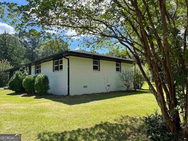 view of home's exterior featuring a yard