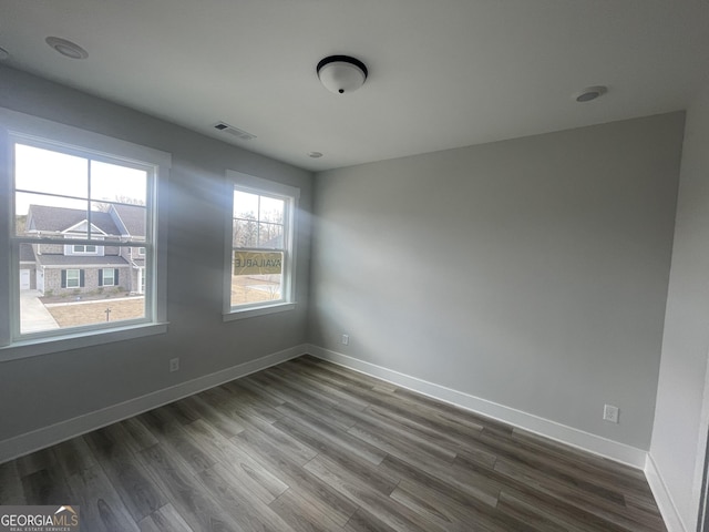 unfurnished room featuring hardwood / wood-style floors