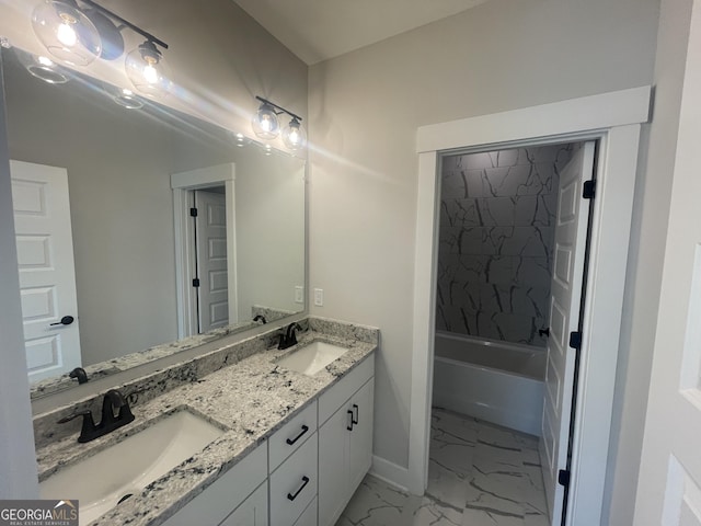 bathroom with vanity and tiled shower / bath combo