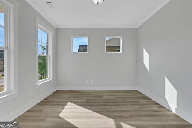 unfurnished living room with ceiling fan, dark wood-type flooring, and a wealth of natural light