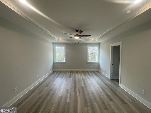 unfurnished room featuring dark hardwood / wood-style floors and ceiling fan