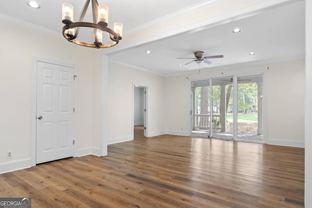 interior space with ornamental molding, ceiling fan with notable chandelier, and hardwood / wood-style floors