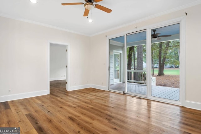 spare room featuring ceiling fan, ornamental molding, and hardwood / wood-style floors