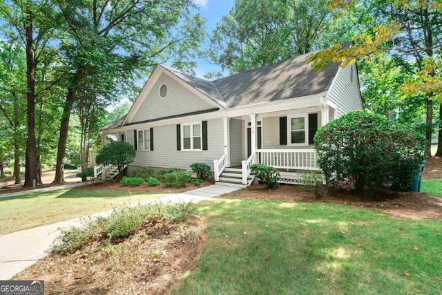 view of front of home with a front lawn and covered porch