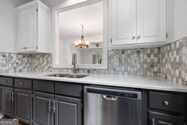 kitchen featuring white cabinets, sink, tasteful backsplash, stainless steel dishwasher, and an inviting chandelier