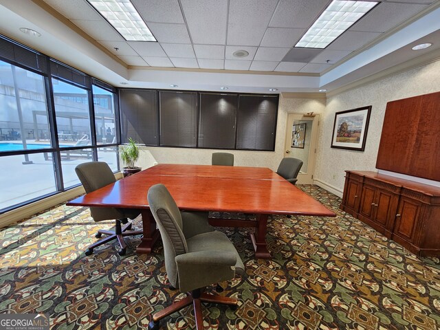 home office featuring a drop ceiling and carpet