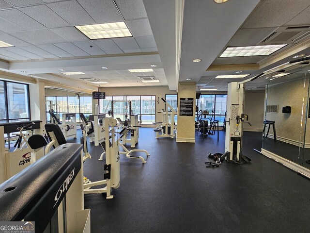 workout area featuring a drop ceiling