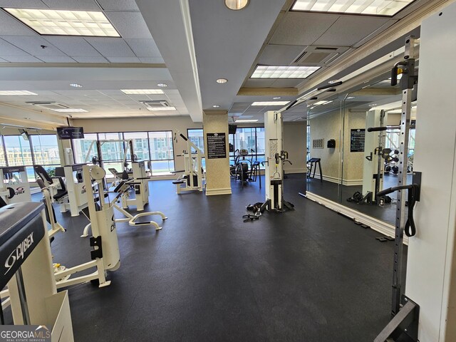 workout area featuring a drop ceiling