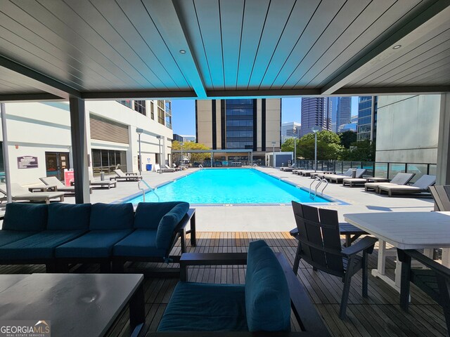 view of swimming pool with an outdoor living space