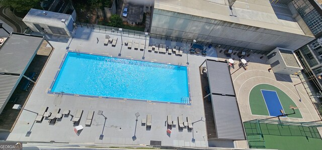 view of pool featuring basketball court