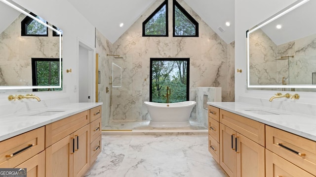 bathroom featuring a healthy amount of sunlight and vanity