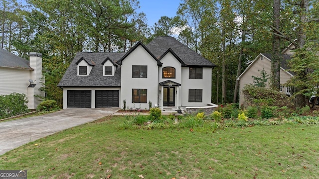 view of front of house featuring a garage and a front yard