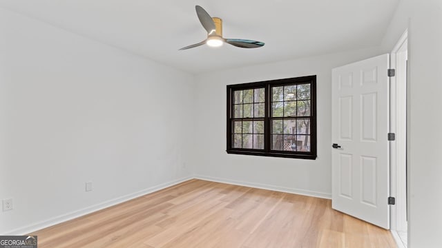 empty room with light wood-type flooring and ceiling fan