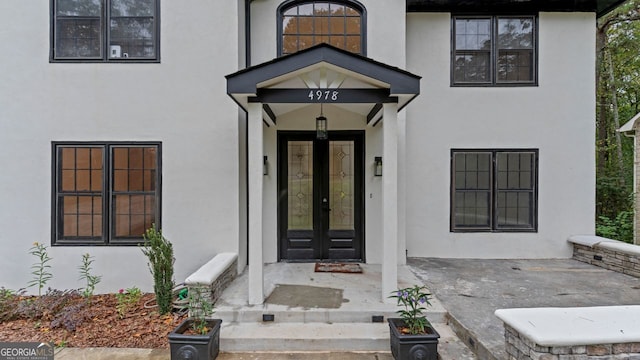 property entrance featuring french doors