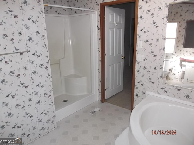 bathroom with a shower and tile patterned floors