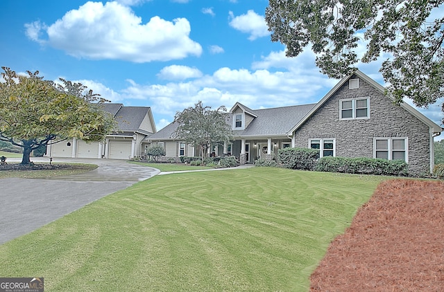 view of front facade with a garage and a front lawn