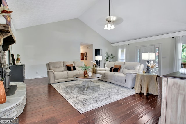 living room featuring ceiling fan, dark hardwood / wood-style floors, and high vaulted ceiling