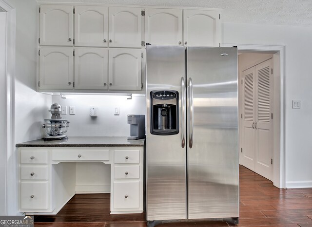 kitchen with white cabinets, a textured ceiling, stainless steel fridge with ice dispenser, and dark hardwood / wood-style flooring