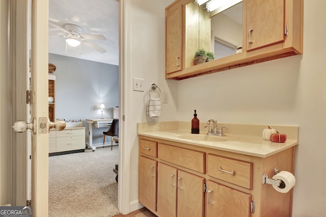 bathroom with ceiling fan and vanity