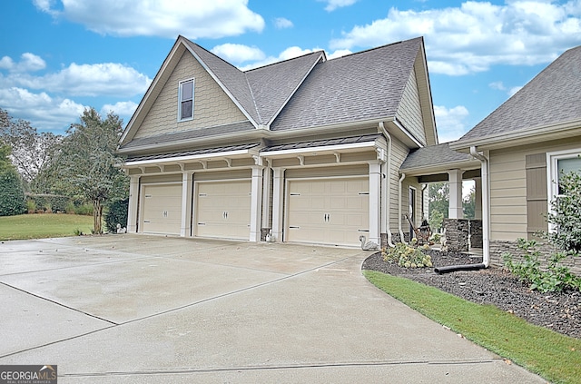 view of side of home featuring a garage